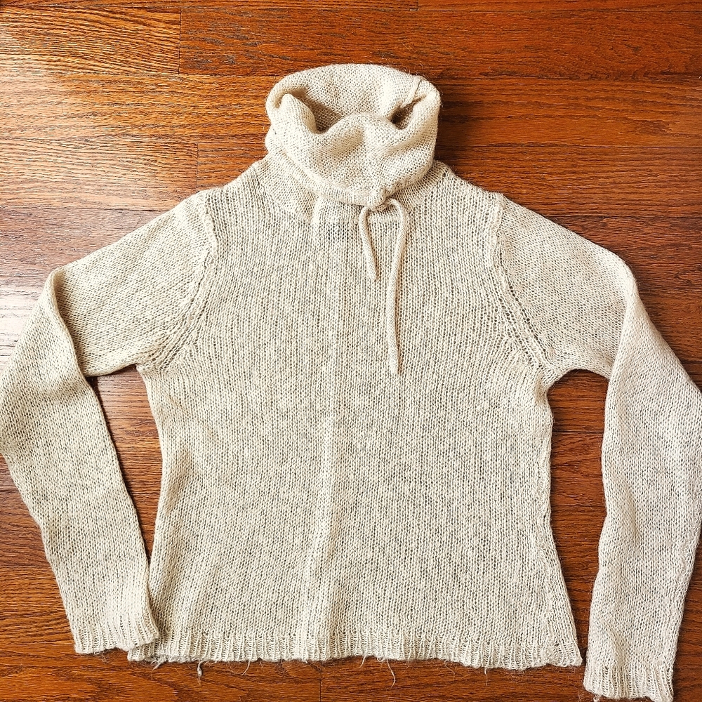 Docker's Tan Turtleneck Sweater